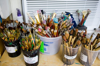 Paint brushes in an art classroom