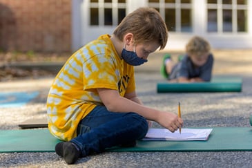Fourth-grade student learning outdoors