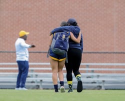 Mother supports daughter after tough soccer game