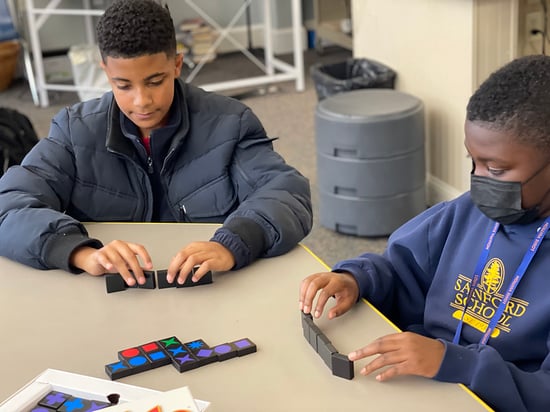 Students play qwirkle