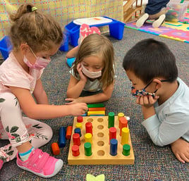 PreK students play together